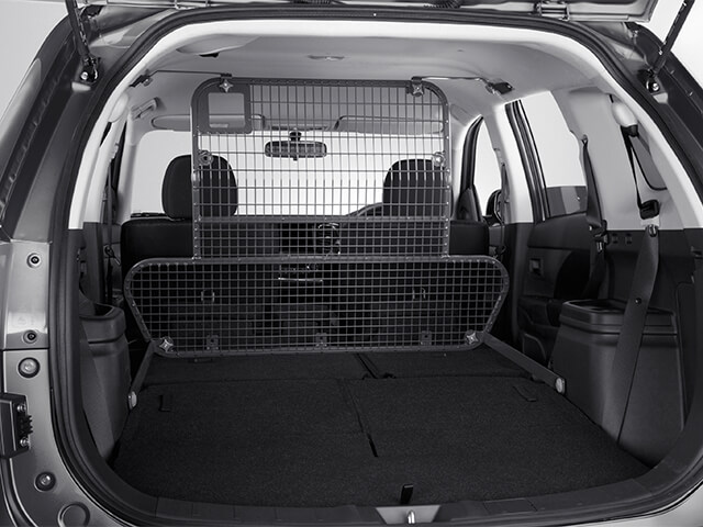 Rear interior view of the installed Cargo Barrier in a Mitsubishi SUV PHEV.