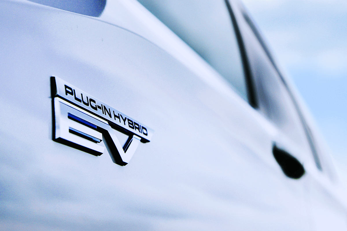 Plug-In Hybrid PHEV badge, on Mitsubishi Outlander front quarter panel
