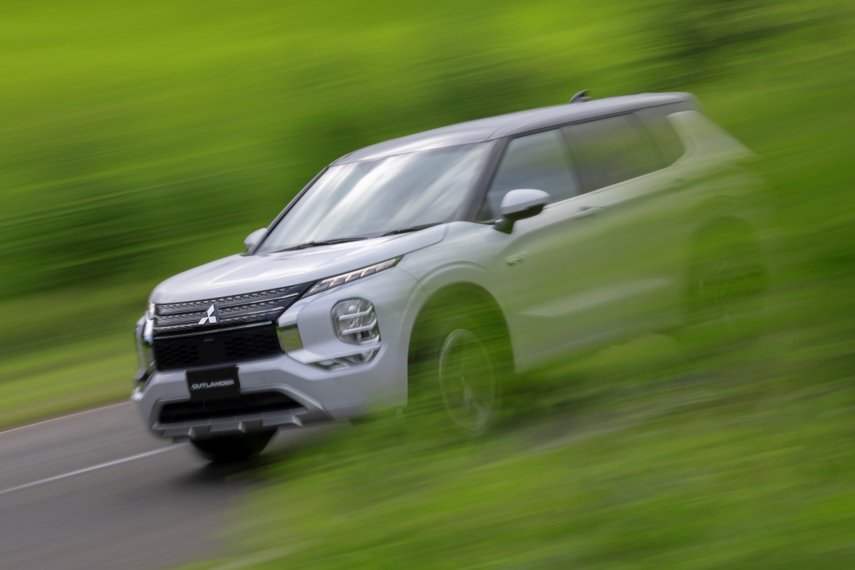 Next generation Mitsubishi Outlander PHEV in white with motion tracking blur