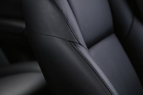 A detail close up shot of black leather seat in Pajero Sport