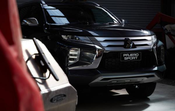 Front of a black Pajero Sport parked in garage